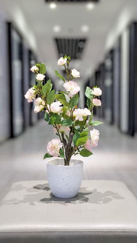 pink artificial rose potted plant.