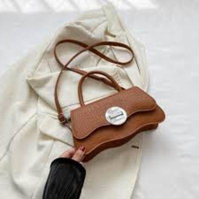 small, brown top-handle bag