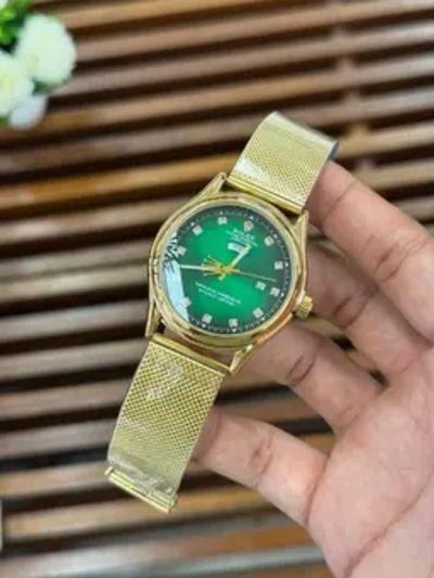 Elegant Gold-Tone Rolex Watch with Green Dial